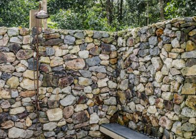 Outdoor shower behind villa